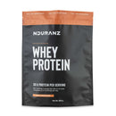 Nduranz Whey Protein – 820 g, okus mlečna čokolada, črno-rjava embalaža za ponovno zapiranje z navodili za uporabo na belem ozadju.