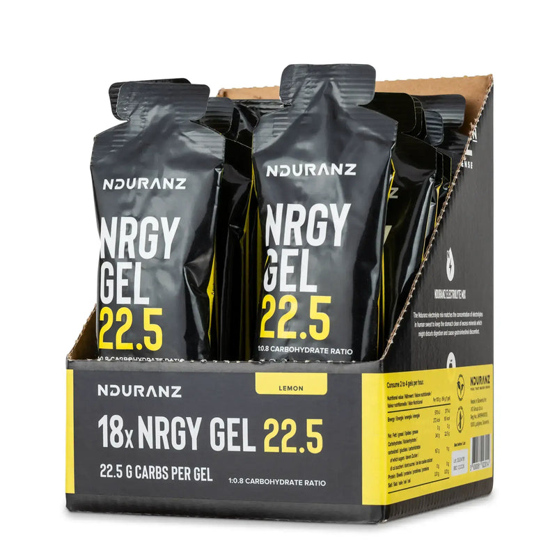 Nduranz Nrgy Gel 22.5 Box - 18 x 66 g okus limone, škatla odprta na vrhu s črnimi paketki z rumenim in belim besedilom na belem ozadju.